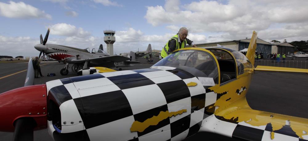Mrs Andy Wallace checks the interior of a Marchetti aircraft prior to flying.