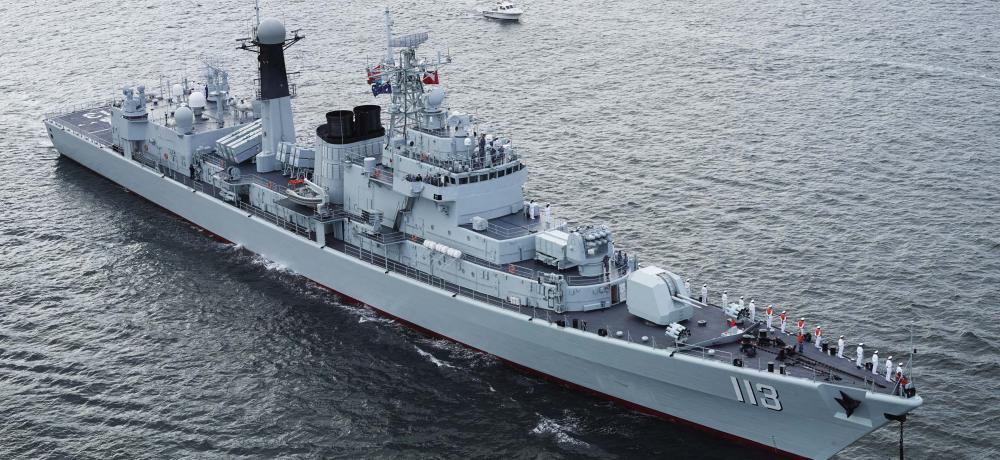 PLAN Quigdao, a Luhu Class guided missile destroyer with the Peoples Liberation Army Navy prepares to berth in Sydney Harbour for the International Fleet Review.