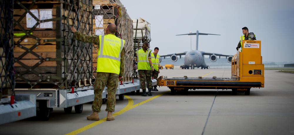 Cargo bound for the Ukraine is checked on the tarmac at Eindhoven Airfield in the Netherlands prior to being loaded onto a Royal Australian Air Force C-17A Globemaster.