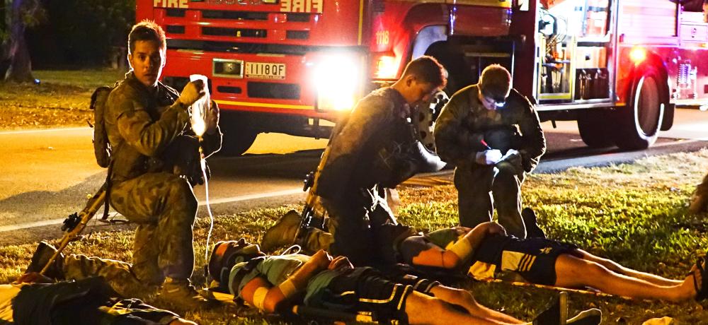 Australian Army personnel assist emergency services at a simulated car crash scene in Ingham as part of a Royal Military College—Duntroon peacekeeping training exercise in northern Queensland between 28 October and 12 November 2014.