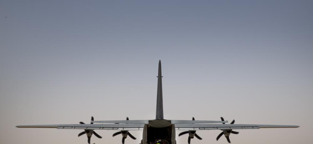 A Royal Australian Air Force C-130J Hercules transport aircraft is loaded with cargo on the taxiway of El Gorah Airfield in the Sinai, Egypt. The aircraft and its crew are conducting a sustainment flight in support of Operation MAZURKA.