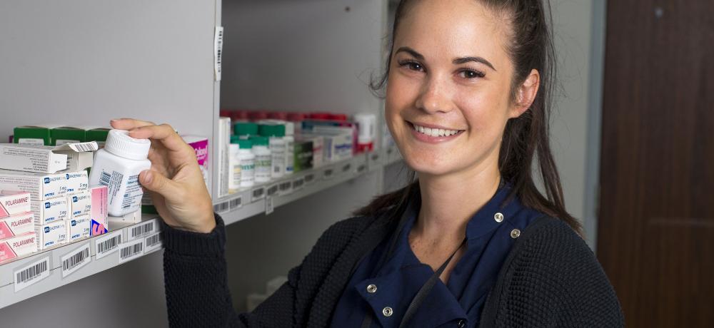 Ms Bobbie-Jo Stagg fills a script at the pharmacy at HMAS Stirling Health Centre