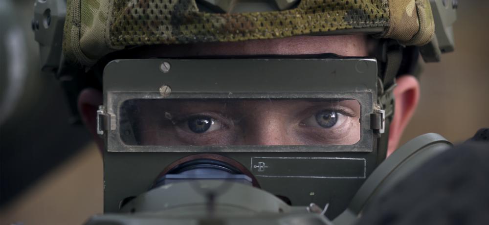 16th Air Land Regiment, Royal Australian Artillery, aims an RBS-70 short range missile system during High Mobility Artillery Rocket System (HiMARS) live fire demonstration at the Shoalwater Bay Training Area. (This image has been digitaly altered)