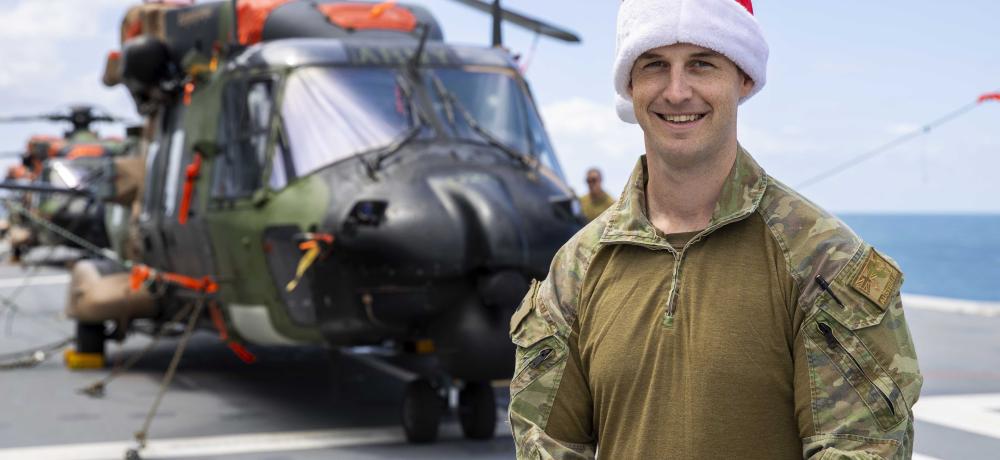 Australian Army officer Major Ash Watt, spends Christmas day aboard HMAS Adelaide as it sails to Fiji to provide Humanitarian Assistance and Disaster Relief to those affected by Cyclone Yasa.