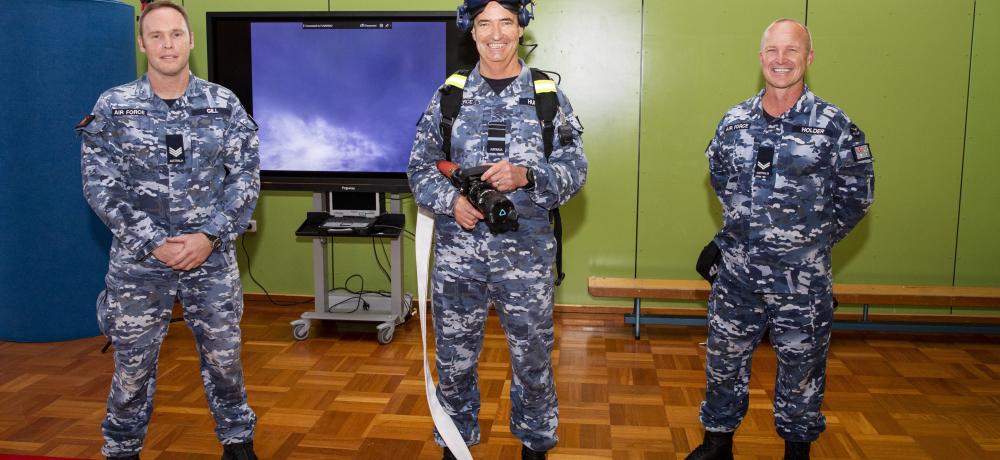 Chief of Air Force, Air Marshal Mel Hupfeld, AO, DSC, (centre) with Sergeant Neil Gill (left) and Corporal Mark Holder from the RAAF Security and Fire School after experiencing the Virtual Reality Flame Trainer during a visit to RAAF Base Amberley, Queensland.