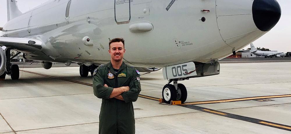 Maritime Patrol and Response Officer, Flight Lieutenant Bradley McMaster in front of a Royal Australian Air Force P-8A Poseidon aircraft - operated by No. 11 and No. 292 Squadrons based at RAAF Base Edinburgh.