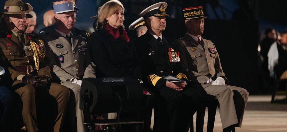 Vice Chief of the Australian Defence Force, Vice Admiral David Johnston AO, RAN, (2nd from the right) and French Chief of Defence Staff, General Thierry Burkhard (right) sit with military officials and dignitaries from Australia and France during the spirit of the Anzac Day Dawn Service in Villers- Bretonneux, France
