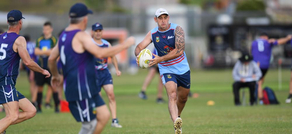 Flight Sergeant Shawn Spry splits the middles in an attacking foray against the over 50 men’s Storm defence.