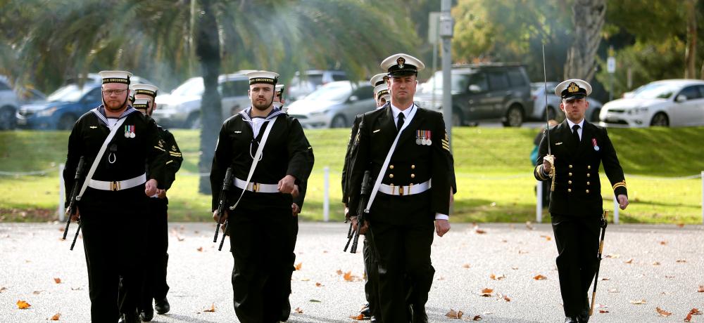 Royal Australian Navy sailor Petty Officer Physical Training Instructor Martin Kaye leads the guard for HMAS Encounter at the commencement of their commissioning ceremony at Torrens Parade Ground, Adelaide, South Australia.