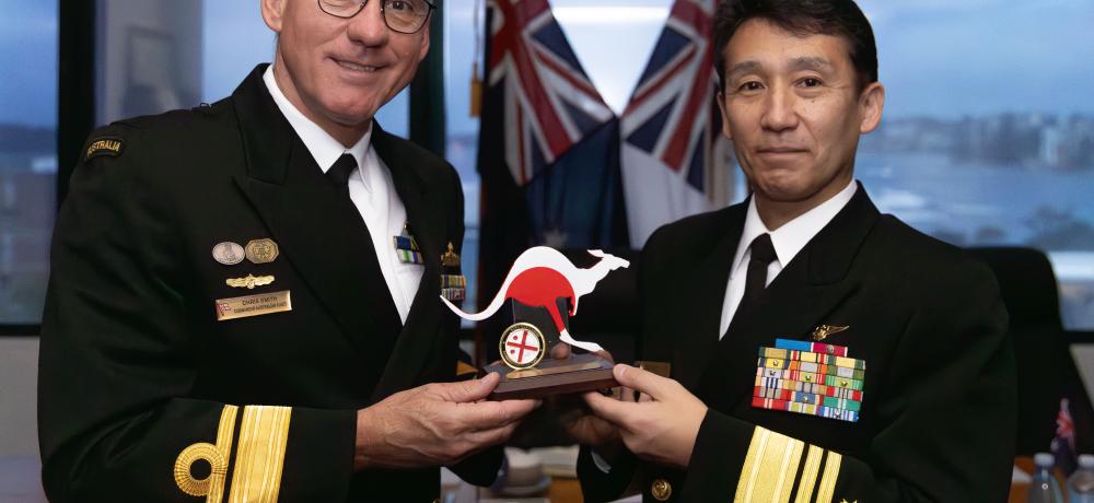 Commander Australian Fleet Rear Admiral Christopher Smith, AM, CSM, RAN, (left) exchanges gifts with Japan Maritime Self-Defense Force Commander in Chief Vice Admiral Omachi Katsushi, during bilateral meetings held with foreign Navy dignitaries at Fleet Headquarters, 