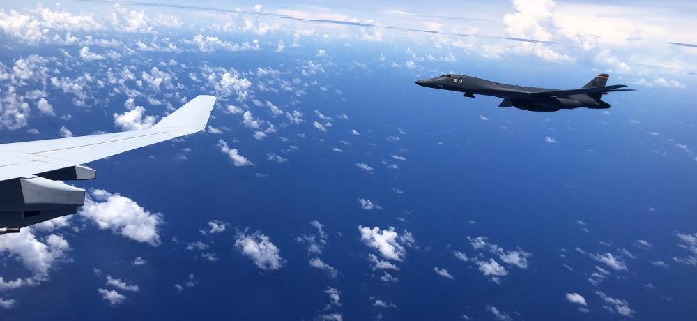 A United States Air Force B-1 Lancer aircraft alongside a Royal Australian Air Force KC-30A Multi-Role Tanker Transport aircraft above Guam as part of an Australia/US interoperability mission during the Regional Presence Deployment.