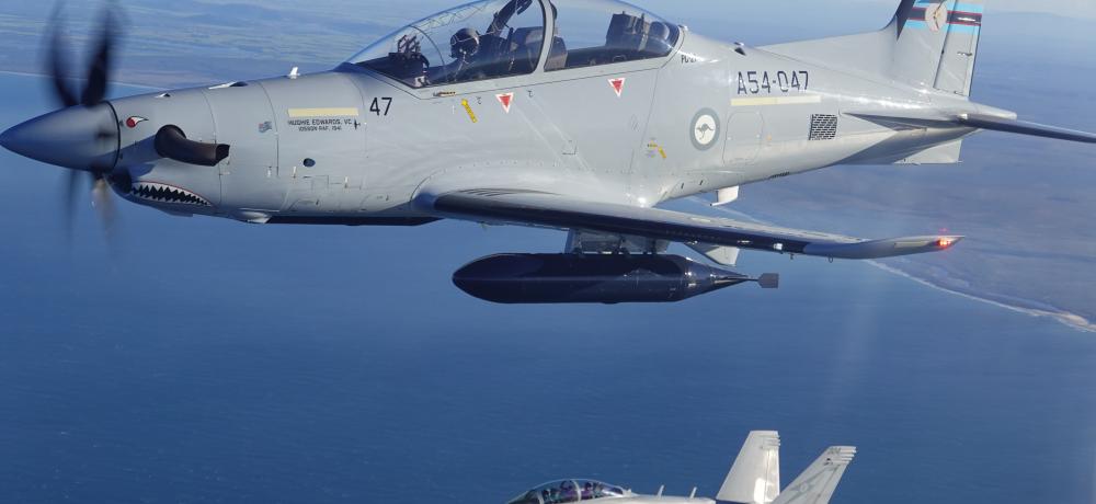 A Royal Australian Air Force No 6 Squadron EA-18G Growler (bottom) and No 4 Squadron PC-21 aircraft exercise a ground Scheme of Manoeuvre in the vicinity of RAAF Base Amberley during Exercise Phoenix Sabre 2025