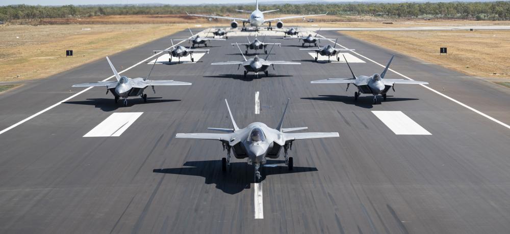 U.S. Air Force F-22A Raptors assigned to the 27th Expeditionary Fighter Squadron along with Royal Australian Air Force F-35A Lightning IIs from No 75 Squadron and a KC-30A Multi Role Tanker Transport aircraft from No 33 Squadron, demonstrate a show of force by conducting an elephant walk at RAAF Base Tindal, Australia,
