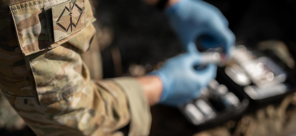 Medics from Australia's Special Operations Command conduct equipment checks and mission preparations on a simulated casualty in Queensland during Exercise Talisman Sabre 25.