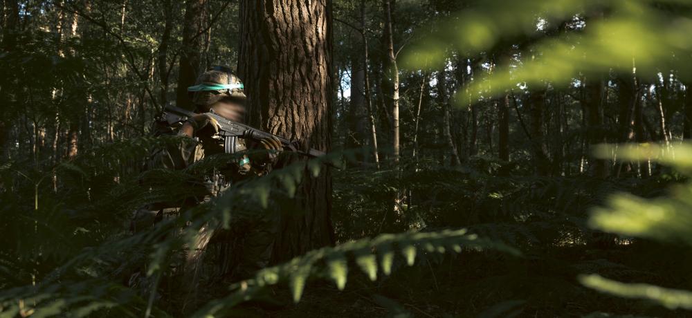 An Armed Forces of Ukraine soldier patrols before conducting a trench clearance serial as part of OP KUDU Rotation 10 in the United Kingdom.