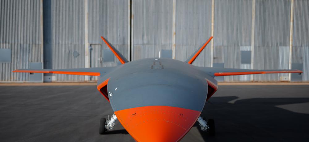 MQ-28A Ghost Bat aircraft in front of a hangar.