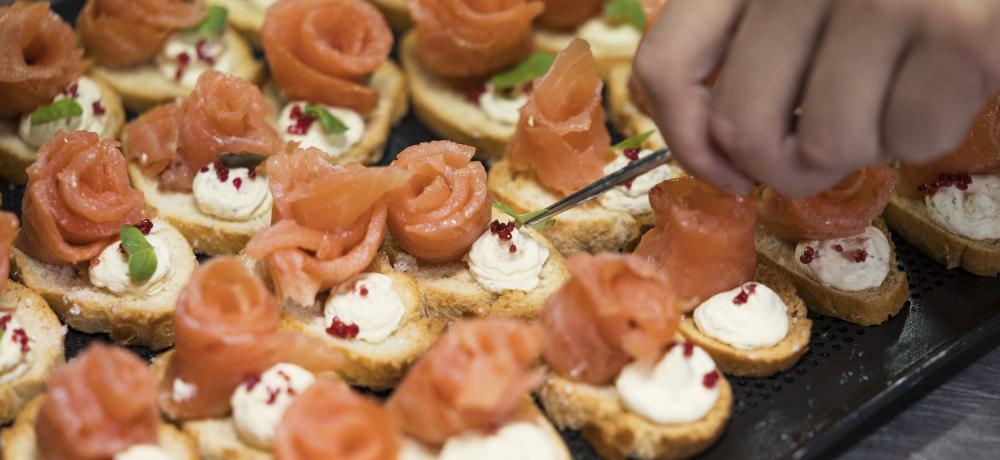 Royal New Zealand Navy and Royal Australian Navy Chefs prepare food in the galley onboard HMAS Canberra for an Official Reception held alongside Wellington, New Zealand.