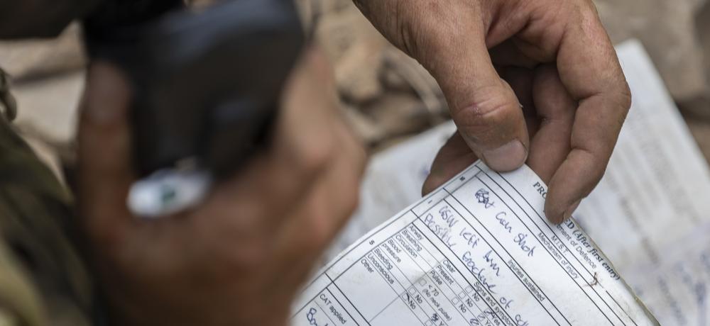 n Australian Army soldier from 1st Battalion, The Royal Australian Regiment, transmits an exercise NATO 9-Liner report during a trench clearance as part of Exercise Brolga Sprint, at Townsville Field Training Area, Queensland on 12 June 2025.