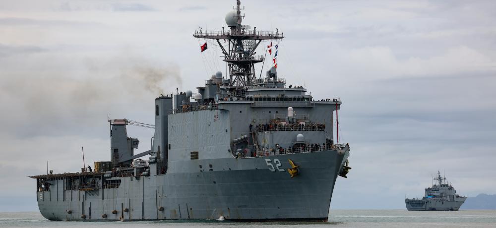 United States Navy Ship USS Pearl Harbor alongside at Lae in Papua New Guinea as the Republic of Korea Ship II Chul Bong departs during Exercise Pacific Partnership.