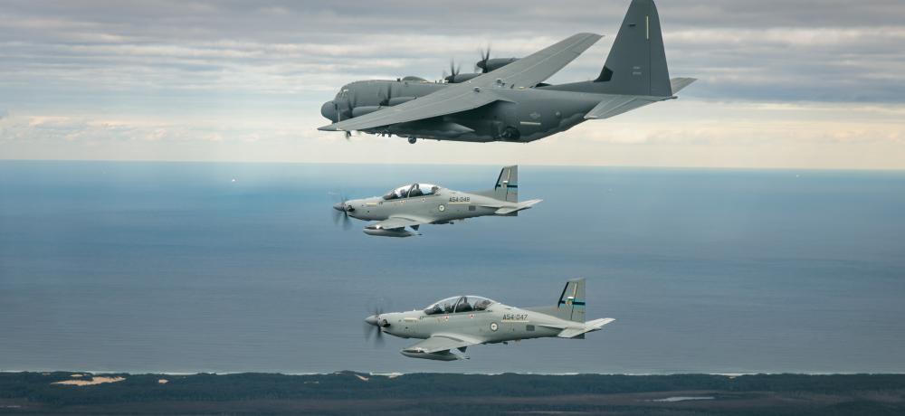 Two Royal Australian Air Force PC-21 with the United States Air Force AC-130J Ghostrider aircraft 