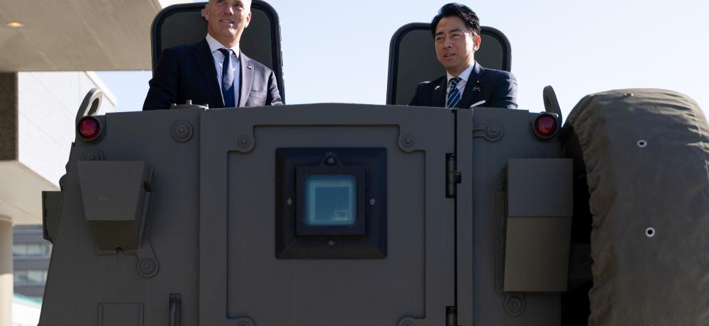 Japanese and Australian Defence Ministers on vehicle. 