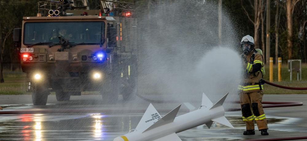 Fire fighter keep a training missile cool
