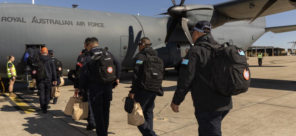 Pacific Police Support Group, board a Hercules 