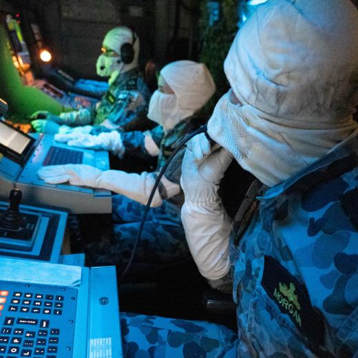 Lieutenant Benjamin Morgan gives the command to dispose of a dummy sea mine on board HMAS Gascoyne during Exercise Dugong 2021.