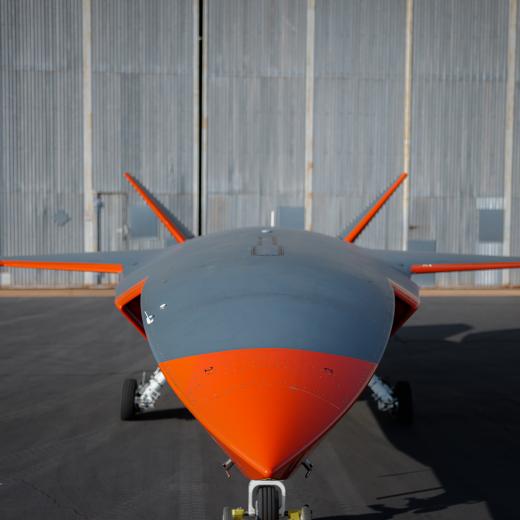 MQ-28A Ghost Bat aircraft in front of a hangar.