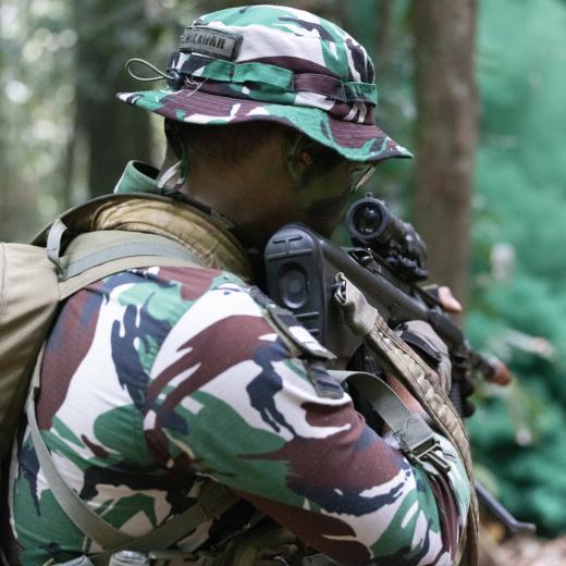 Indonesian Army soldiers (Tentara Nasional Indonesia) participating in a section attack at the Junior Officer Combat Instructor Training Course held in Tully, November 2024. Mid Caption: