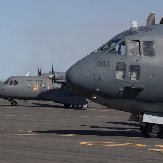 A French Air and Space Force CASA CN-225 taxiing beside a No. 35 Squadron C-27J Spartan at Bundaberg Airport, Queensland.