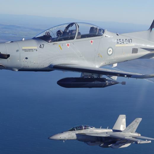 A Royal Australian Air Force No 6 Squadron EA-18G Growler (bottom) and No 4 Squadron PC-21 aircraft exercise a ground Scheme of Manoeuvre in the vicinity of RAAF Base Amberley during Exercise Phoenix Sabre 2025