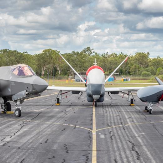A F-35A Lightning II, MQ-4C Triton and MQ-28A Ghost Bat on the tarmac during Exercise Carlsbad at RAAF Base Tindal.
