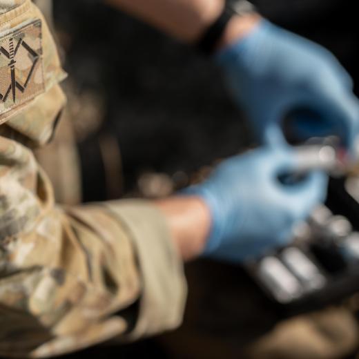 Medics from Australia's Special Operations Command conduct equipment checks and mission preparations on a simulated casualty in Queensland during Exercise Talisman Sabre 25.