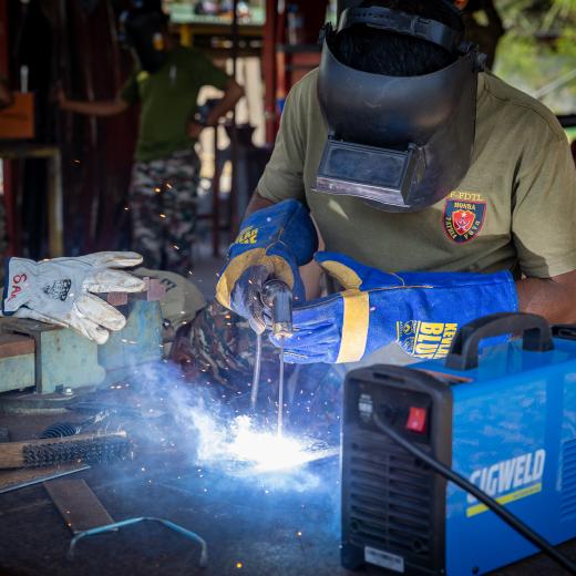 Soldiers from the Timor-Leste Defence Force practice welding under supervision from a member of the Royal New Zealand Army Logistics Corps during Exercise HARI'I HAMUTUK 2024, in Metinaro Military Base, Timor-Leste.