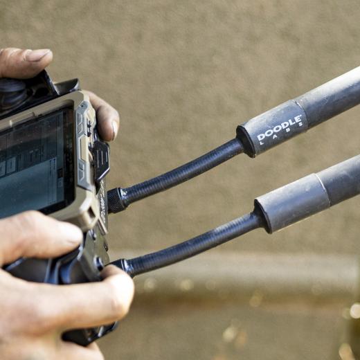An Australian Army soldier from the 1st Armoured Regiment, controls the M134D minigun remote weapon station attached to a Modular Robotic Vehicle during Exercise Talisman Sabre at Townsville Field Training Area, Queensland on 28 July 2025.