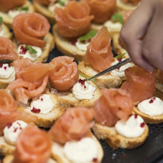 Royal New Zealand Navy and Royal Australian Navy Chefs prepare food in the galley onboard HMAS Canberra for an Official Reception held alongside Wellington, New Zealand.