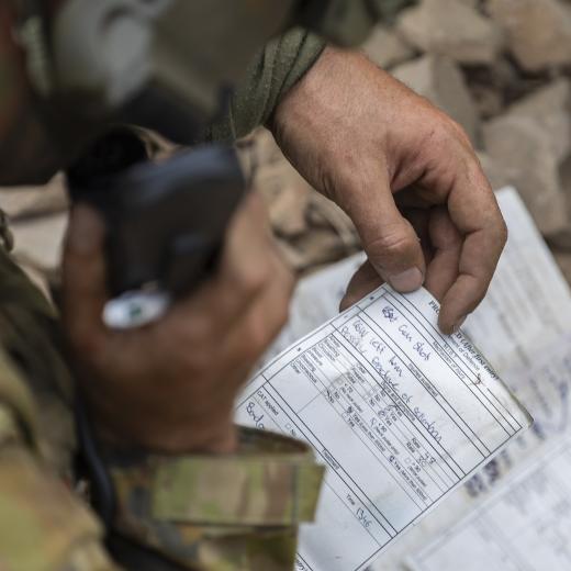 n Australian Army soldier from 1st Battalion, The Royal Australian Regiment, transmits an exercise NATO 9-Liner report during a trench clearance as part of Exercise Brolga Sprint, at Townsville Field Training Area, Queensland on 12 June 2025.