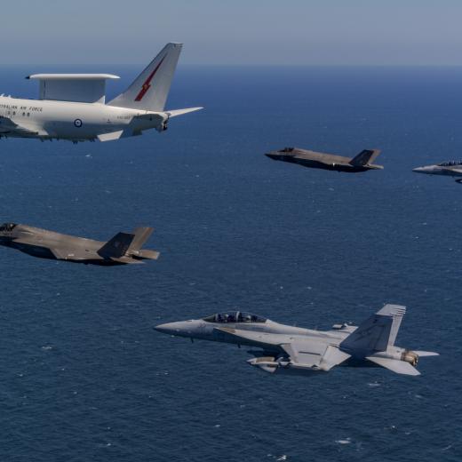 Royal Air Force and United States Marine Corps F-35B Lightning IIs and a EA-18G Growler fly along with a Royal Australian Air Force E-7A Wedgetail over the Northern Territory airspace during Exercise Talisman Sabre 2025.