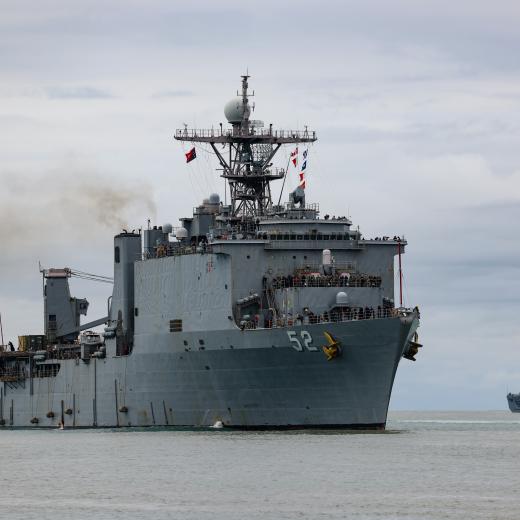 United States Navy Ship USS Pearl Harbor alongside at Lae in Papua New Guinea as the Republic of Korea Ship II Chul Bong departs during Exercise Pacific Partnership.