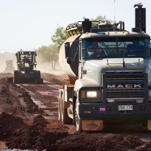 Australian Army heavy vehicles constructing a road.