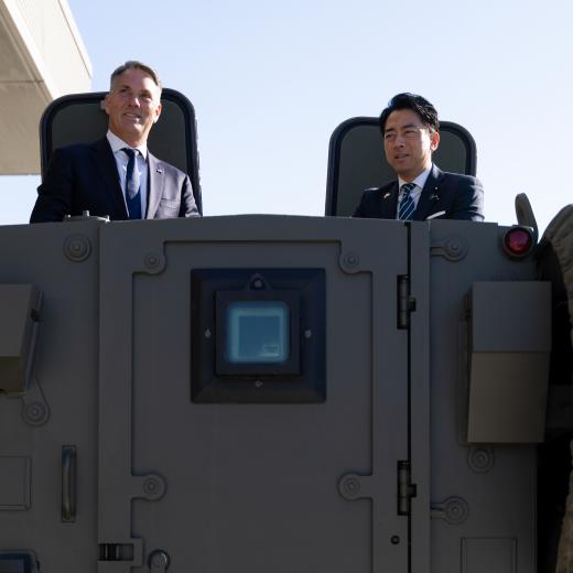 Japanese and Australian Defence Ministers on vehicle. 