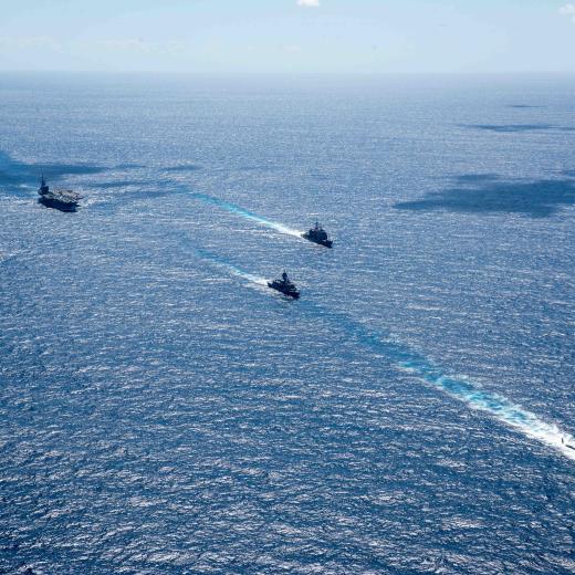 USS Ronald Reagan in formation with  HMAS Perth and others