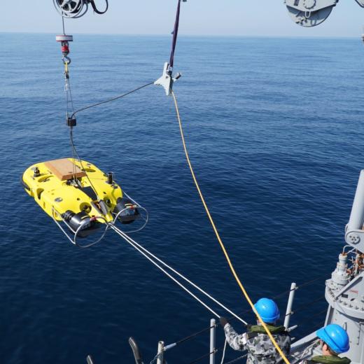 HMAS Gascoyne launch remotely operated vehicle, Double Eagle, to search for a simulated mine during an annual live Mine Disposal Charge firing,