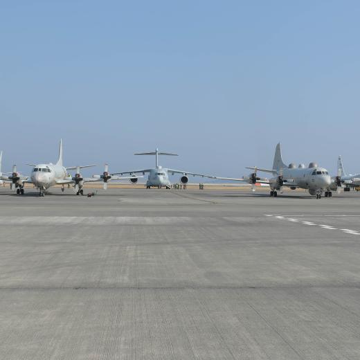 Australian, American, and Japanese aircraft on the tarmac at Marine Corps Air Station Iwakuni in Japan during a trilateral training and engagement activity. RAAF P-8A Poseidon; Japan Maritime Self-Defense Force EP-3 Orion; Japan Air Self-Defense Force RC-2