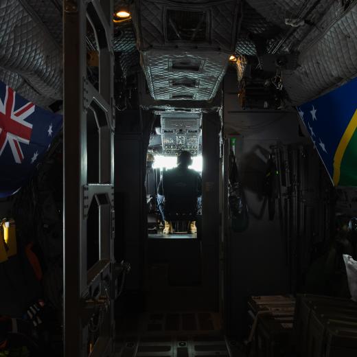 Australian and Solomon Islands flags inside a Spartan aircraft.